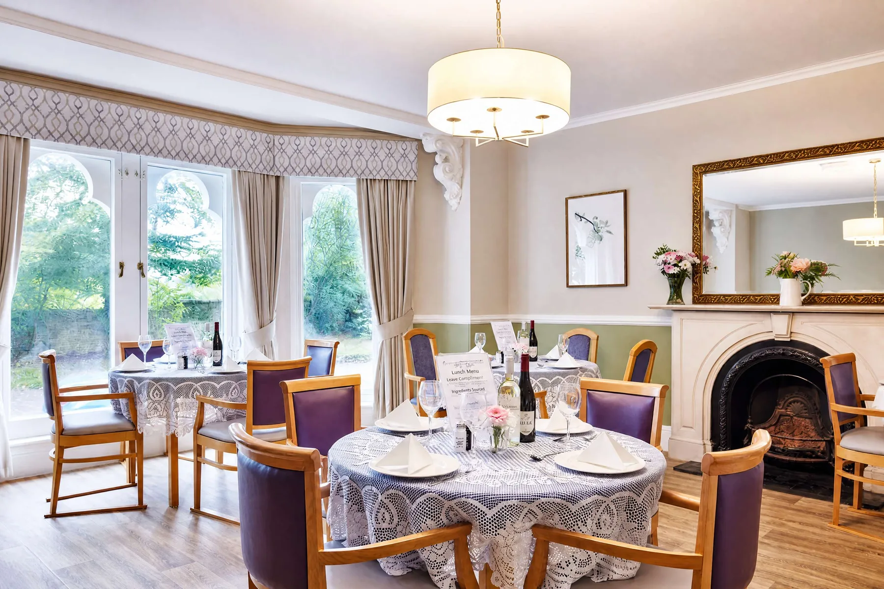 Residents sharing a meal together around the dining table at Belmont Castle